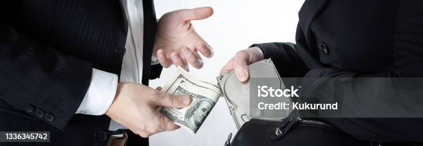 The Scene Of Selling Confidential Information On The Hard Disc Drive Of Competitors Or Officials For The Wad Of Bills In Us Dollars Wide Image Stock Photo - Download Image Now