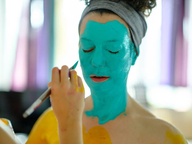 istock Two women Artists  during body painting session 1336347198