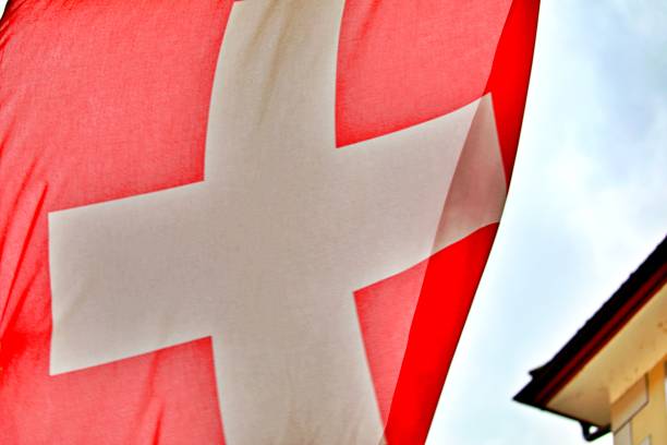 istock swiss flagg in the city 1336348342