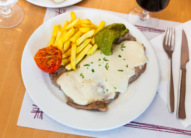 istock Appetizing beef steak with creamy Roquefort sauce 1336348456