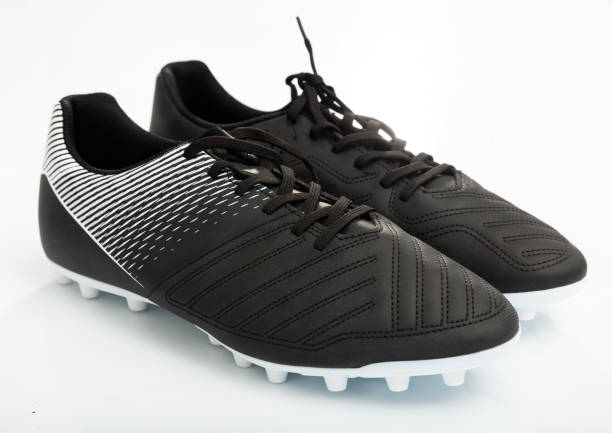 istock Football boots isolated on white background 1336348460