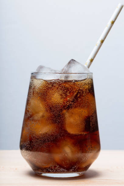 istock rum with cola and ice in a glass close-up, cola with ice 1336348744