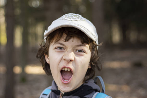 Portrait of screaming boy outdoor stock photo