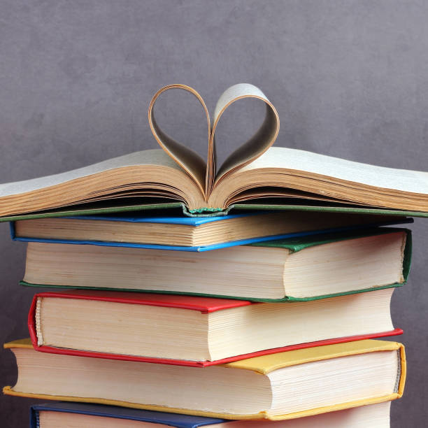 istock stack of thick hardcover books heart shaped pages 1336355436