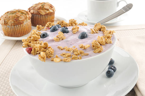 A bowl of blueberry muffins topped with honey oat granola