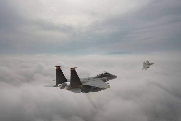 istock Jet fighters flying over the clouds. 1336358924