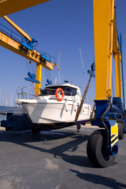 istock boat crane travelift lifting motorboat 1336359923