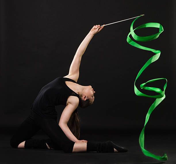 istock beautiful gymnast with green ribbon 133636007