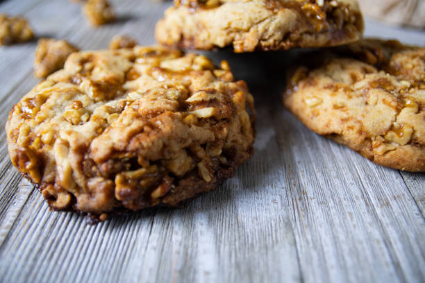 Walnut cookies stacked on top of each other. Close up view on wooden table