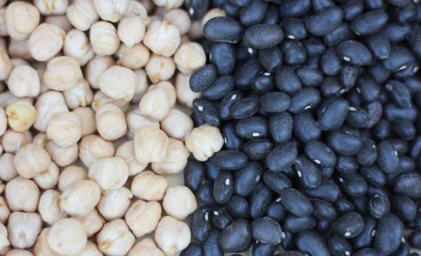 istock Spilled Black Beans and Chickpeas Close up Background 1336360443