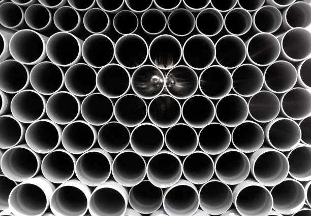 istock gray PVC tubes plastic pipes stacked in rows 1336360976