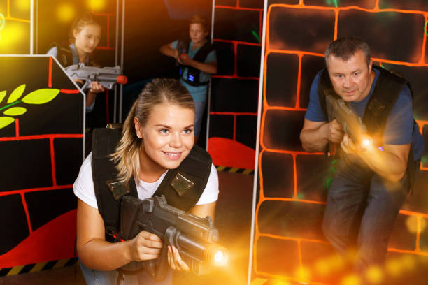 istock Woman playing lasertag with family 1336361477