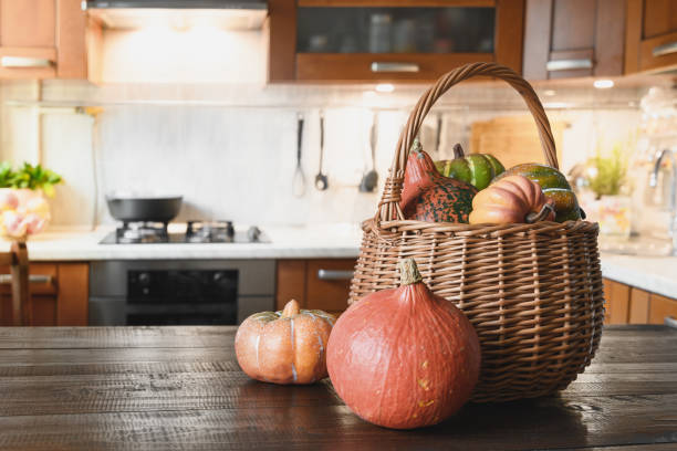 istock Kitchen table top with pumpkins for cooking on Thanksgiving day or Halloween party. 1336361555