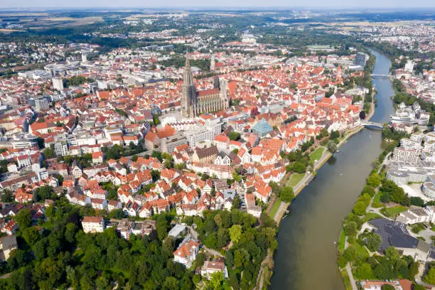 Aerial view of the City of Ulm (on the left) and Neu Ulm (on the right),  old town, Ulm Minster, and the river Danube, Baden Wurttemberg, Bavaria, Germany.