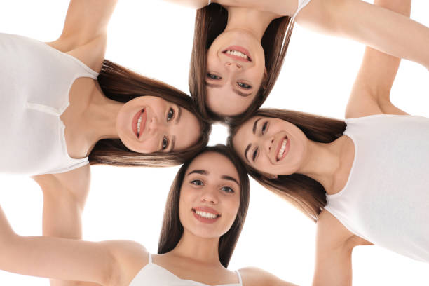 istock Beautiful young ladies hugging, bottom view. Woman's Day 1336362798