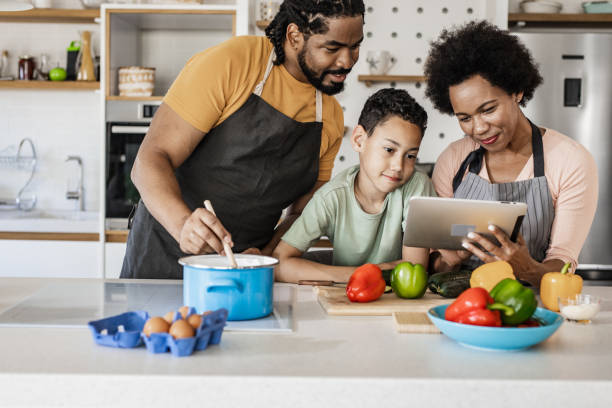 istock Family preparing a healthy meal in the kitchen 1336363321