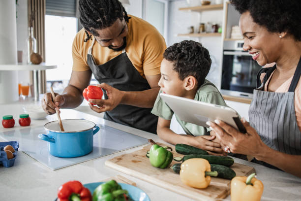 istock Family preparing a healthy meal in the kitchen 1336364176