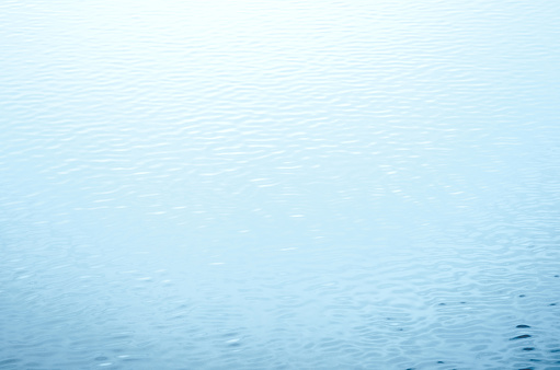 Blue glass with water drops. Wet glass.  Copy space.