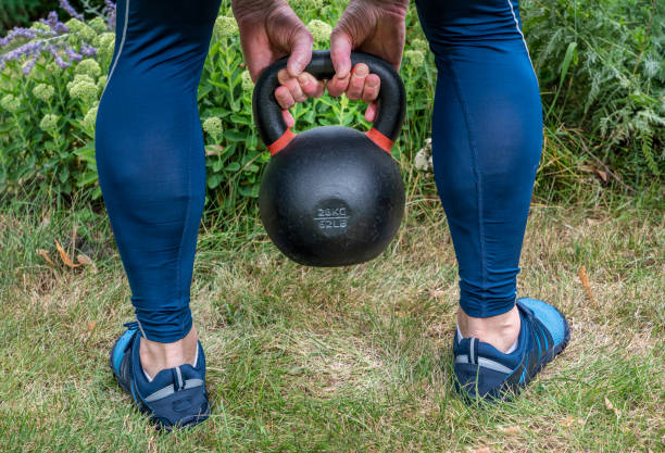 istock kettlebell workout in backyard, home fitness concept 1336367599