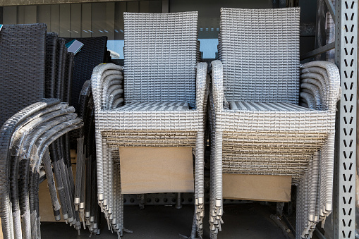 Wicker chairs for garden and backyard. Goods for relaxation and rest in the yard. Background
