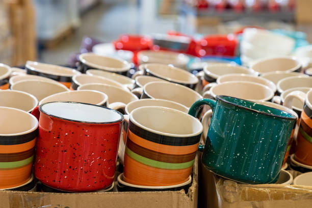 istock New cups or mugs on the store shelf. Selective focus, blurred background. 1336369700