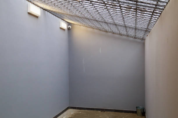 istock typical modern prison or detention facility. Illustrative universal background for crime and news. 1336369786