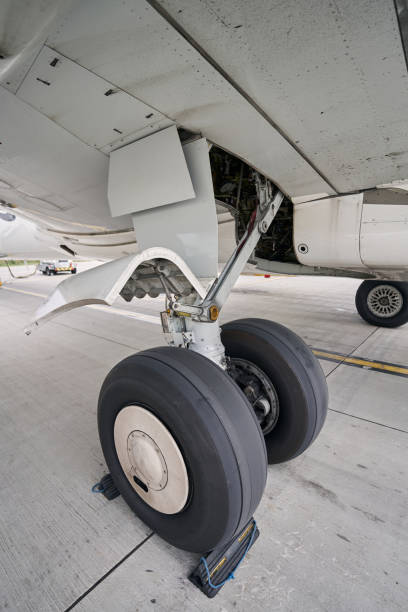 istock Landed civil aircraft parked on the concrete runway 1336369836