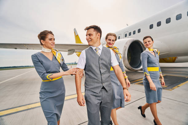 istock Stylish young cabin crew at the airdrome 1336369841