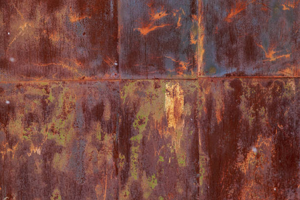 istock Rough textured surface of old rusty metal with peeling paint. 1336370194