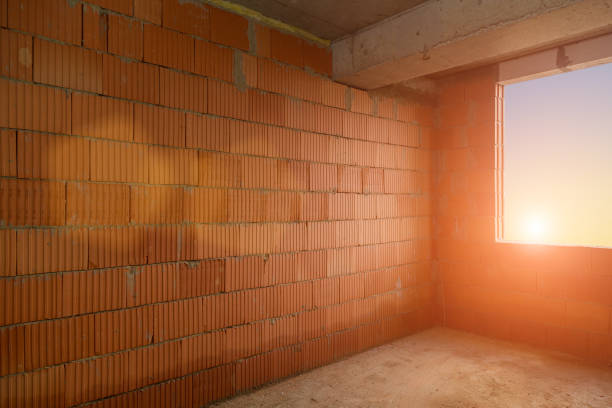 A room in a building under construction. Multi-storey residential buildings. toned background