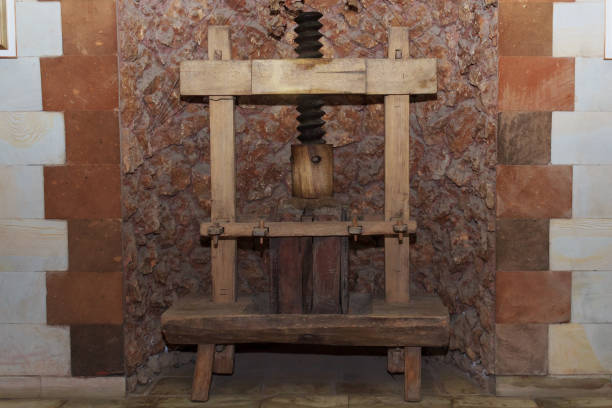 istock An old real press for grapes and fruits. Wine and juice production using old classical technologies 1336371313