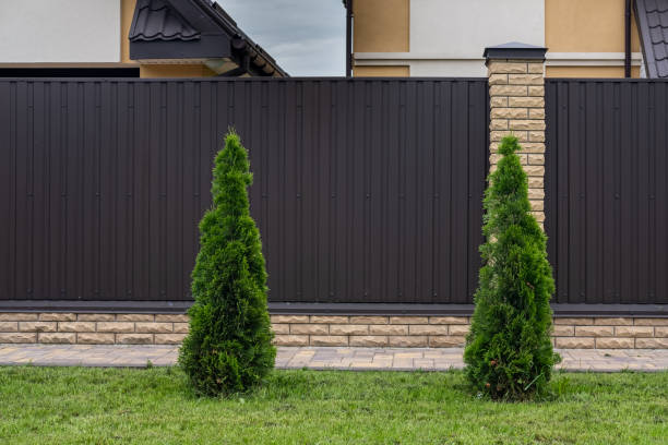 istock Modern brown corrugated iron fence with decorative brick columns. 1336371423