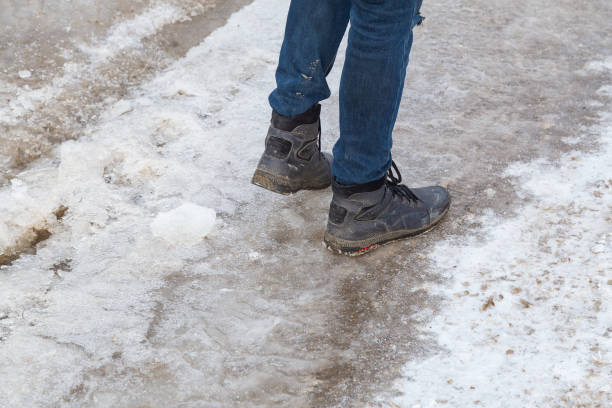 istock Ice on the road. Dangerous slippery surface. 1336371715