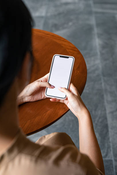 istock Close Up: Anonymous Female Student Sitting in a Cafe and Texting on Social Media 1336373197