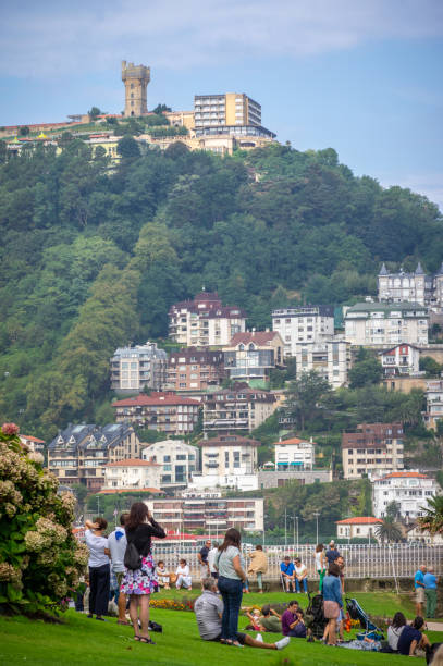 September 9, 2018 - Donostia San Sebastian, Spain: people in front of Monte Igueldo mountain in San Sebastian relaxed in front of playa de la concha
