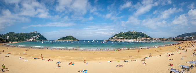 September 9, 2018 - Donostia San Sebastian, Spain: Panoramic view of people swiming in playa de la concha in Donostia San Sebastian, Spain