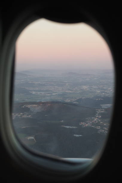 istock Take off at sunset time seen through the airplane window 1336374056