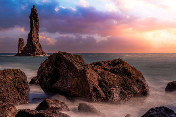 istock Reynisdrangar rocky stacks at Reynisfjara beach (Iceland) 1336375052