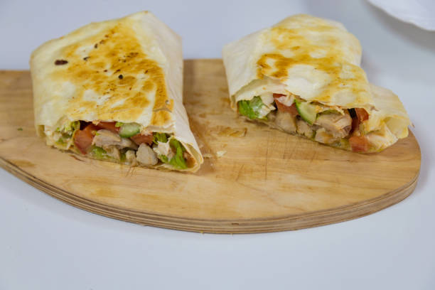 istock Shawarma or kebab cutaway with selective focus. Home cooking. Background with place for inscriptions or text. 1336376143