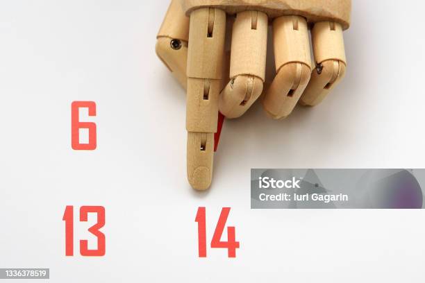 The Finger Of Wooden Hand Points To February 14 On The Calendar Selective Focus Stock Photo - Download Image Now
