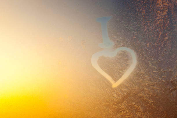 istock a heart painted on a frozen window 1336379489