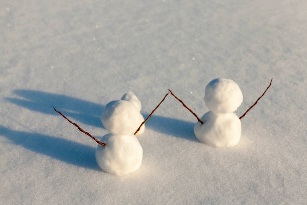 istock snowmen made of snow in winter 1336379503