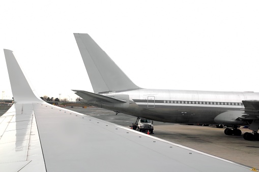 aircraft  landed with side wing perspective in airport