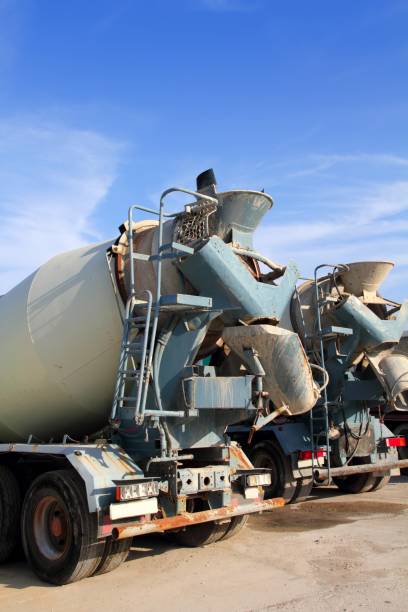istock concrete mixer two trucks rear view grunge 1336384518