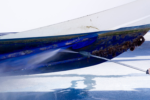 Boat hull cleaning water pressure washer barnacles antifouling and seaweed