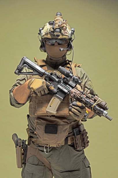 istock Modern military soldier aiming with a rifle. 1336388794