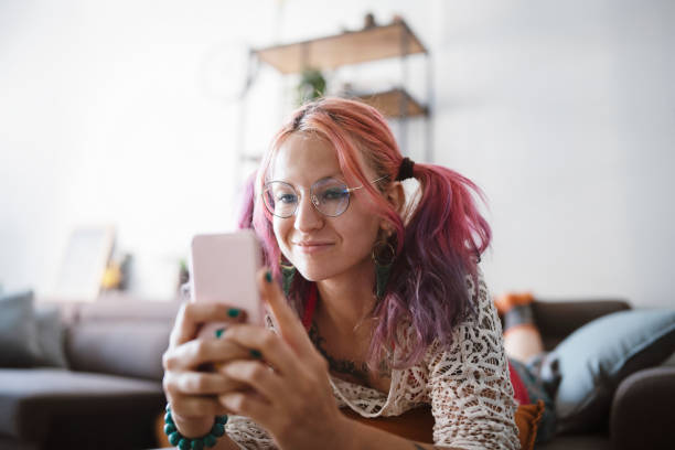 istock Woman using smartphone at home 1336390915