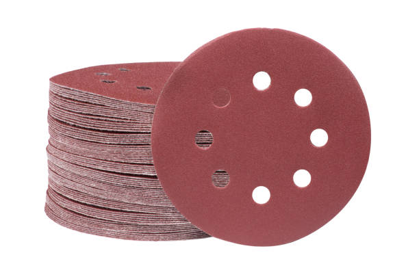 Red round sandpaper disc isolated stock photo
