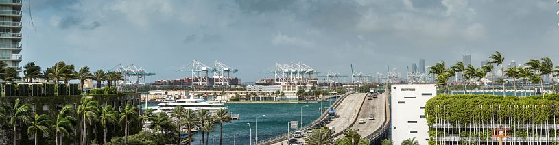 Panoramic view of the southern entrance to Miami Beach and the port area and cruise ships of the Port of Miami, one of the busiest ports in the United States.