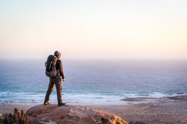 istock backpacker or hiker on the top of the mountain 1336396622
